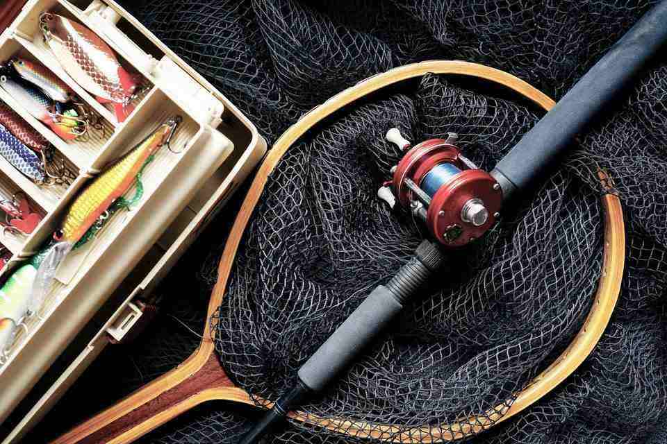Fishing rod with a fishing net and lures for trout fishing
